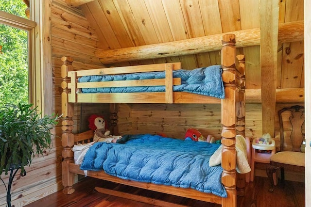 899 S State Rd, Harbor Springs, MI 49740 - bedroom with log walls, wood finished floors, vaulted ceiling, and wooden ceiling