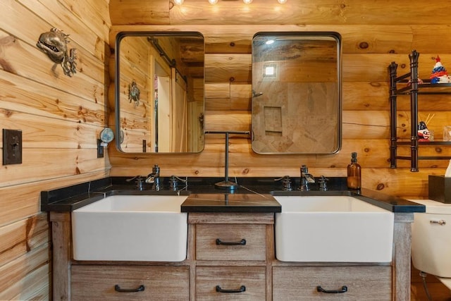 899 S State Rd, Harbor Springs, MI 49740 - bathroom featuring vanity and wood walls