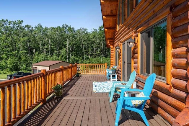 899 S State Rd, Harbor Springs, MI 49740 - wooden terrace with a view of trees