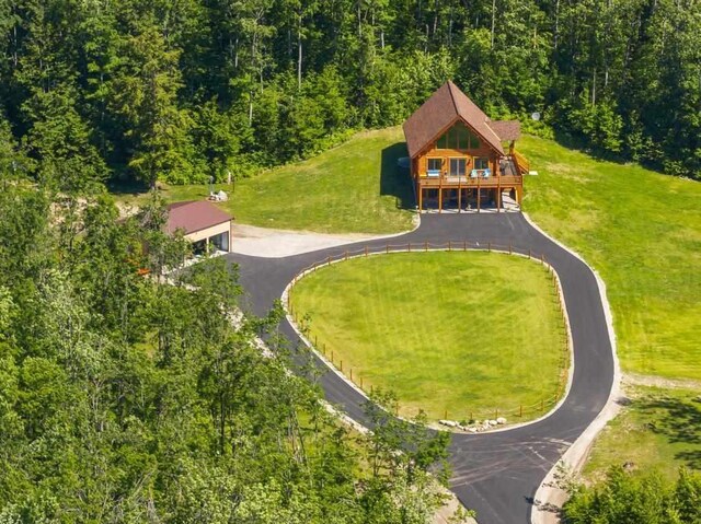 899 S State Rd, Harbor Springs, MI 49740 - aerial view of property and surrounding area featuring a heavily wooded area