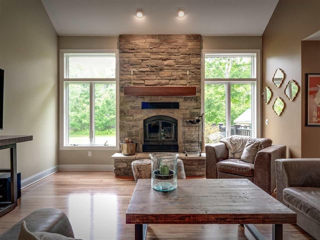 6598 Forest Way, Harbor Springs, MI 49740 - living room with a stone fireplace and wood finished floors
