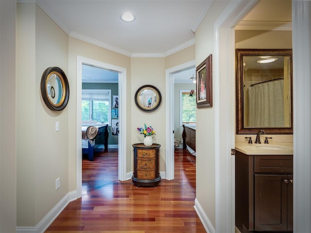 6598 Forest Way, Harbor Springs, MI 49740 - hallway with wood finished floors, ornamental molding, and recessed lighting