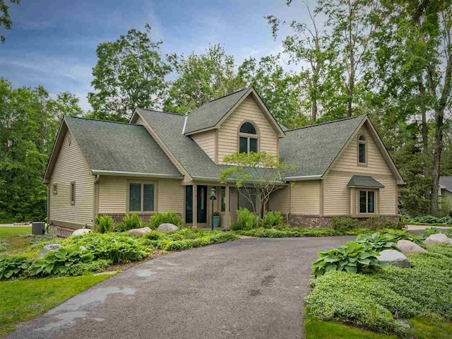 6598 Forest Way, Harbor Springs, MI 49740 - view of front of property with driveway and roof with shingles