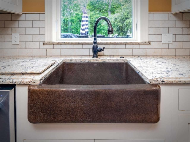 6598 Forest Way, Harbor Springs, MI 49740 - kitchen view of backsplash, light stone counters, and wine cooler