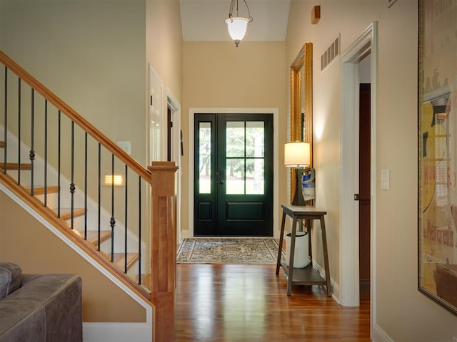 6598 Forest Way, Harbor Springs, MI 49740 - entrance foyer with wood finished floors, stairway, and a towering ceiling