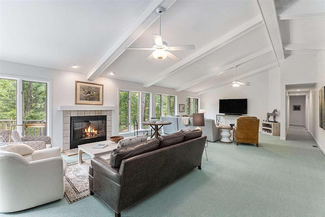1835 Bluffs Edge, Harbor Springs, MI 49740 - carpeted living room with a ceiling fan, a tiled fireplace, and healthy amount of natural light