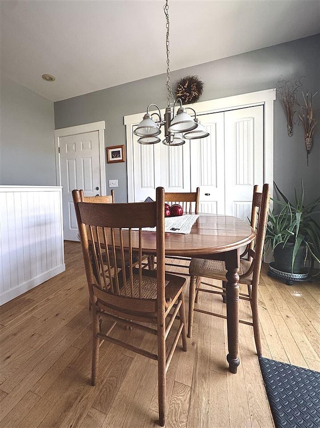 7570 Bay Meadow Dr, Harbor Springs, MI 49740 - dining space with hardwood / wood-style flooring and a chandelier