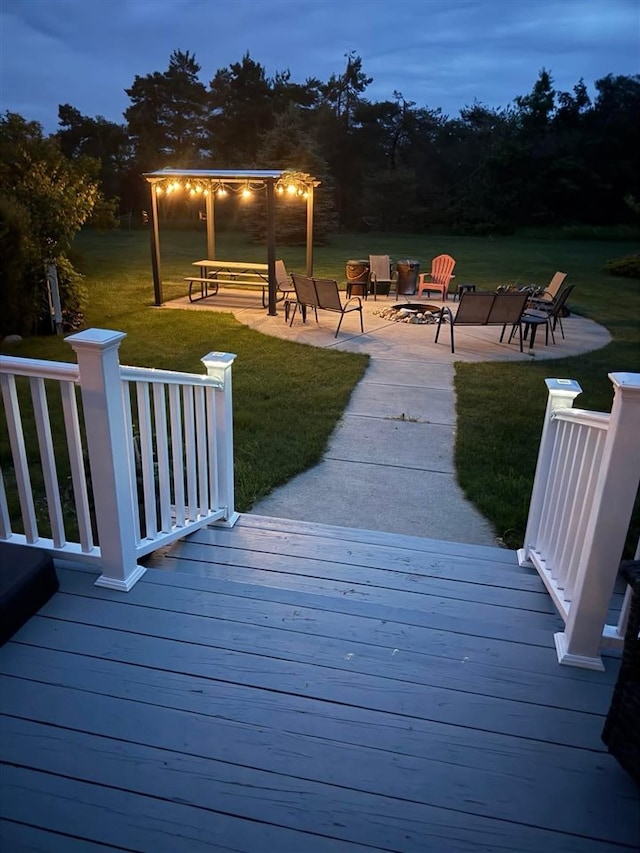 7570 Bay Meadow Dr, Harbor Springs, MI 49740 - wooden deck featuring a lawn and a patio area