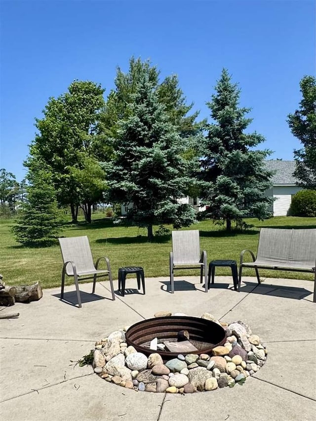 7570 Bay Meadow Dr, Harbor Springs, MI 49740 - view of patio / terrace with an outdoor fire pit