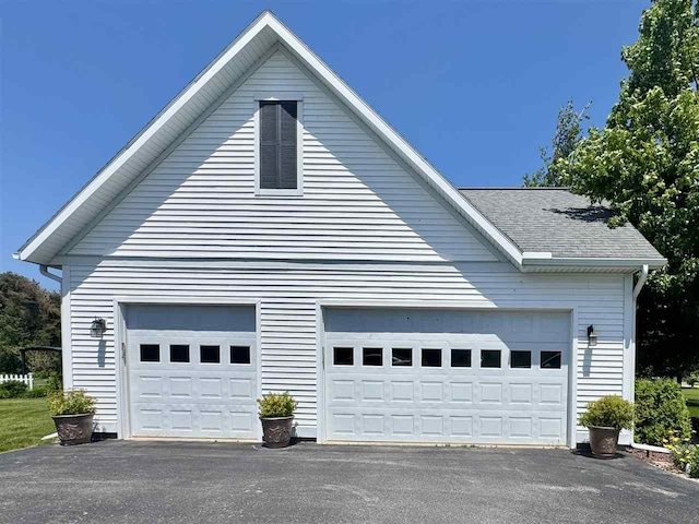 7570 Bay Meadow Dr, Harbor Springs, MI 49740 - garage with asphalt driveway