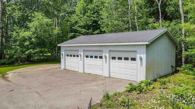 1885 Lalonde Rd, East Jordan, MI 49727 - detached garage with a wooded view