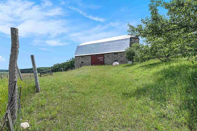 5980 Stanek Rd, East Jordan, MI 49727 - view of yard with a barn and an outdoor structure