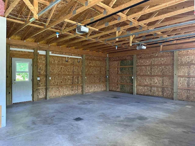 4505 S State Rd, Harbor Springs, MI 49740 - garage featuring a garage door opener