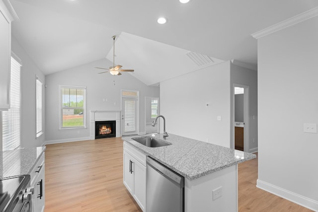 3320 Navin Trl, Roebuck, SC 29376 - kitchen with appliances with stainless steel finishes, a warm lit fireplace, ceiling fan, light wood-style flooring, and recessed lighting