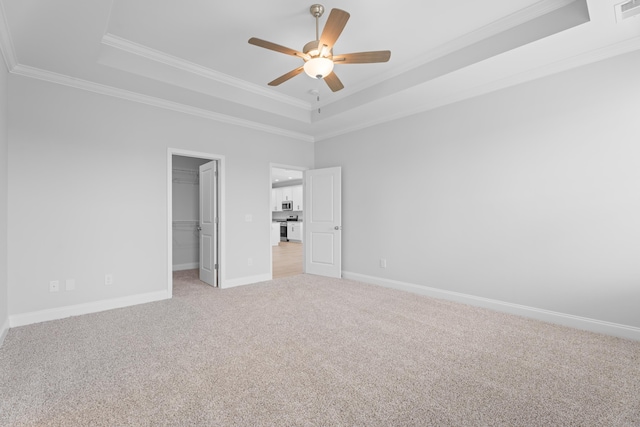 3320 Navin Trl, Roebuck, SC 29376 - unfurnished bedroom featuring a raised ceiling, light carpet, ornamental molding, a spacious closet, and a closet