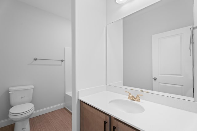 3320 Navin Trl, Roebuck, SC 29376 - bathroom featuring vanity, a tub to relax in, and wood finished floors