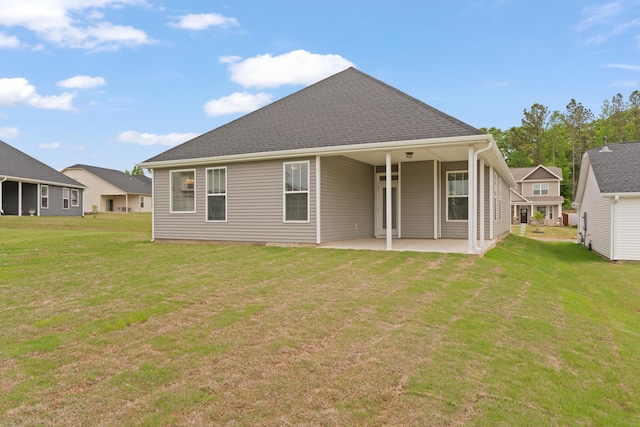 3320 Navin Trl, Roebuck, SC 29376 - rear view of house with a patio area, a lawn, and roof with shingles