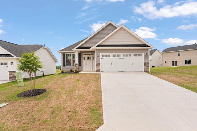 3320 Navin Trl, Roebuck, SC 29376 - craftsman-style home featuring a garage, a front lawn, driveway, and stone siding