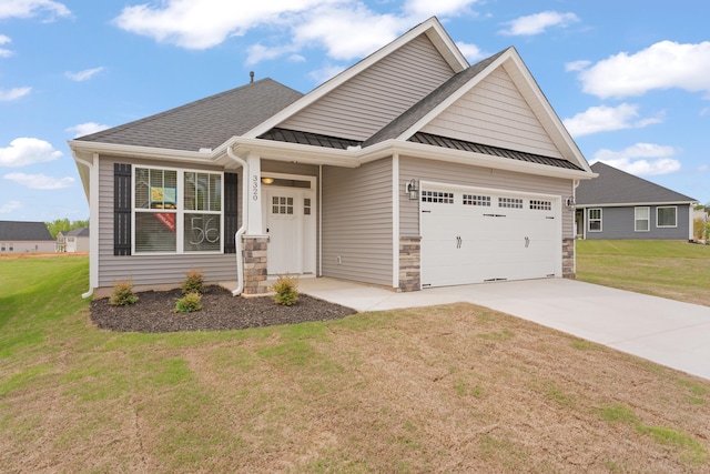 3320 Navin Trl, Roebuck, SC 29376 - craftsman-style house featuring a standing seam roof, a front lawn, concrete driveway, stone siding, and a metal roof