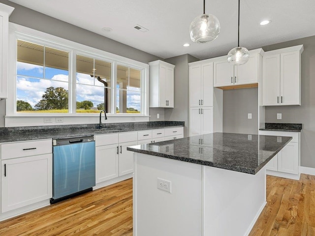 708 Mello Dr, Lyman, SC 29365 - kitchen featuring stainless steel dishwasher, light wood finished floors, white cabinetry, healthy amount of natural light, and recessed lighting
