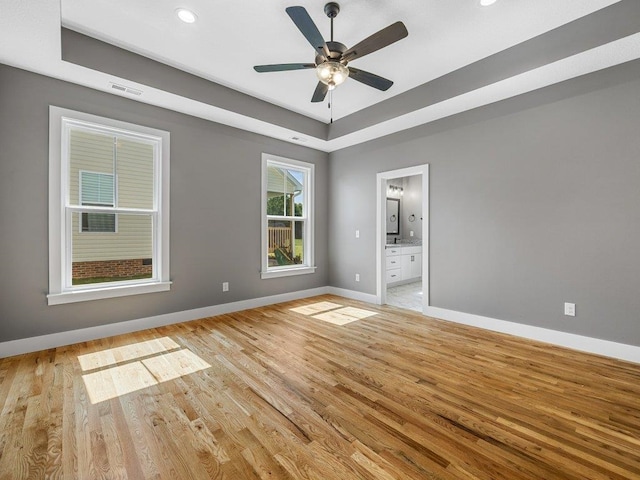 708 Mello Dr, Lyman, SC 29365 - unfurnished room featuring light wood-style floors, ceiling fan, a raised ceiling, and recessed lighting