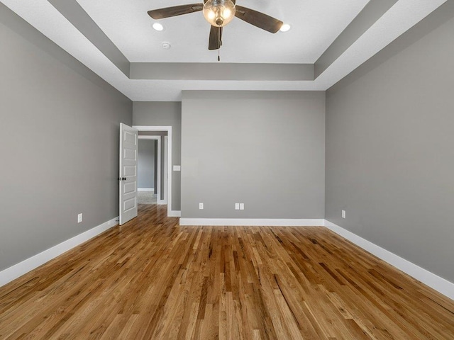708 Mello Dr, Lyman, SC 29365 - spare room featuring a ceiling fan, wood finished floors, recessed lighting, and a raised ceiling