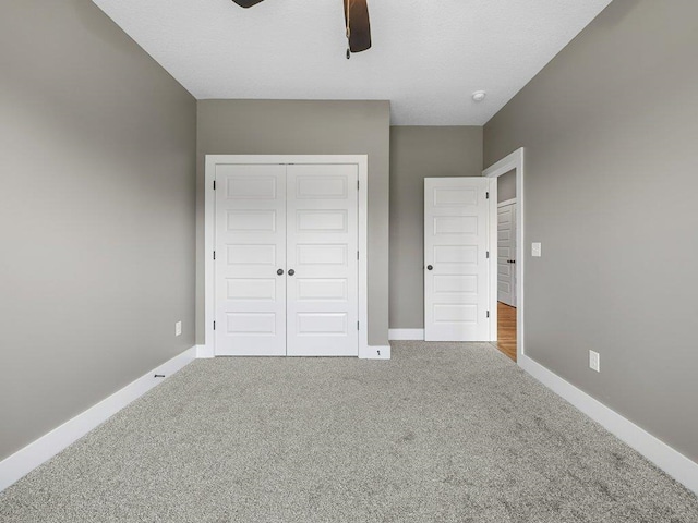 708 Mello Dr, Lyman, SC 29365 - unfurnished bedroom with carpet, a closet, and a ceiling fan