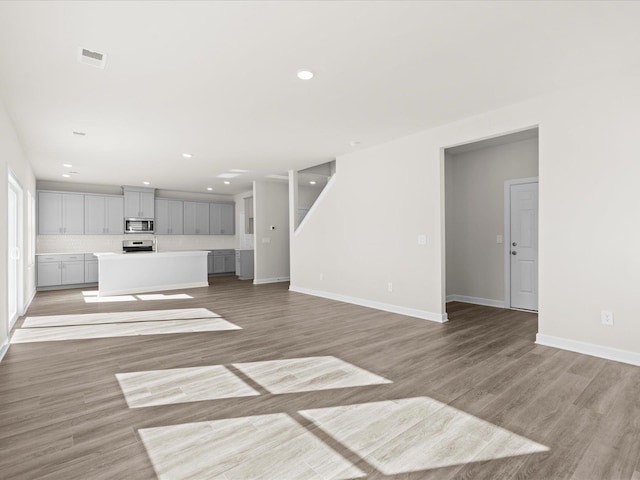119 Martel Dr, Spartanburg, SC 29301 - unfurnished living room featuring light wood-style floors and recessed lighting