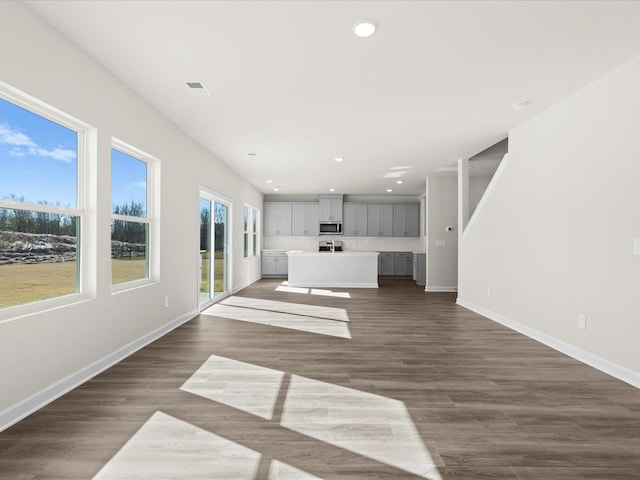 119 Martel Dr, Spartanburg, SC 29301 - unfurnished living room with recessed lighting and dark wood-type flooring