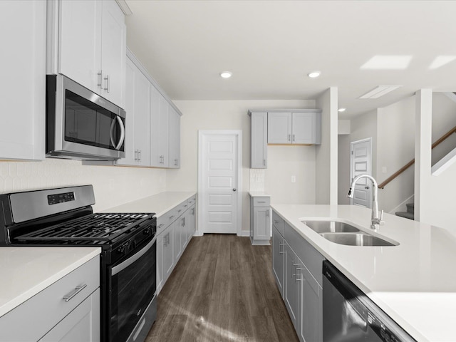 119 Martel Dr, Spartanburg, SC 29301 - kitchen featuring stainless steel appliances, light countertops, dark wood finished floors, decorative backsplash, and recessed lighting