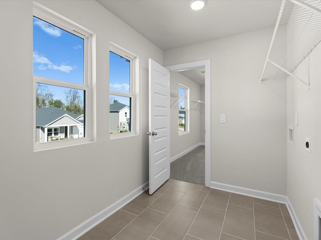 119 Martel Dr, Spartanburg, SC 29301 - laundry area featuring electric dryer hookup and tile patterned flooring