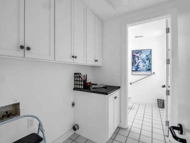 110 W King Ridge St, Gaffney, SC 29341 - washroom featuring washer hookup, cabinet space, hookup for an electric dryer, and light tile patterned floors