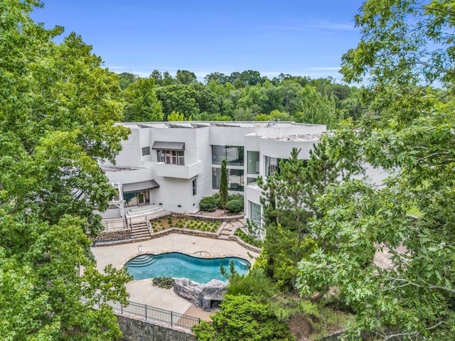 110 W King Ridge St, Gaffney, SC 29341 - back of house featuring stairway, stucco siding, an outdoor pool, and a patio area