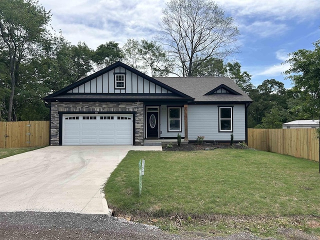 331 Skyline Rd, Greer, SC 29651 - view of front facade featuring concrete driveway, a garage, roof with shingles, and stone siding