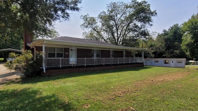 1210 Upper Valley Falls Rd, Boiling Springs, SC 29316 - view of front of house featuring a front yard, a porch, brick siding, and a chimney