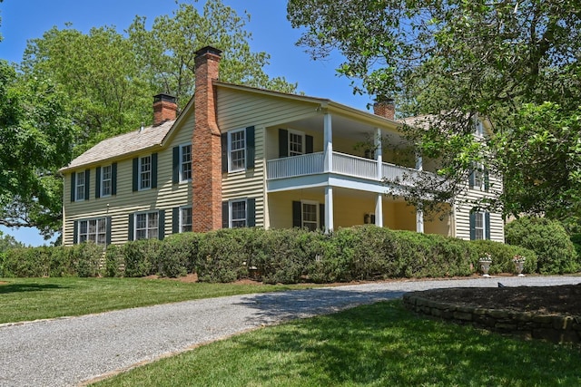 835 Jackson Grove Rd, Columbus, NC 28722 - view of front of home with a chimney, a balcony, a front yard, and driveway