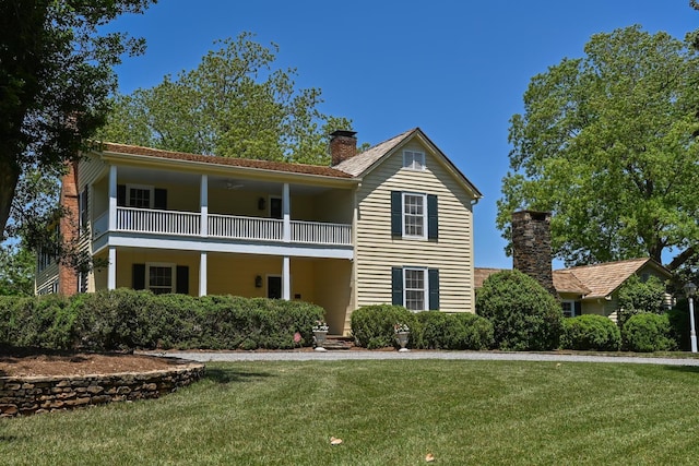 835 Jackson Grove Rd, Columbus, NC 28722 - view of front facade featuring a balcony, a front yard, and a chimney