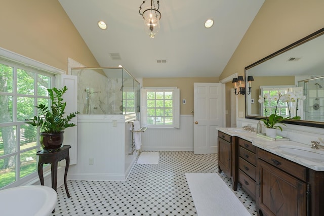 835 Jackson Grove Rd, Columbus, NC 28722 - bathroom with vaulted ceiling, a marble finish shower, a wainscoted wall, double vanity, and a soaking tub