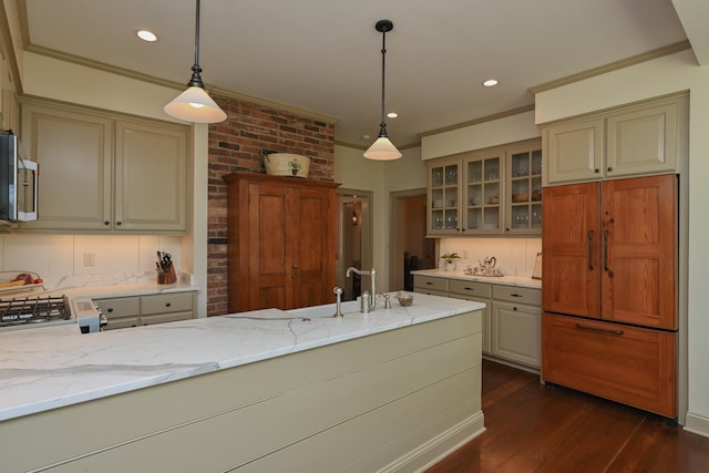 835 Jackson Grove Rd, Columbus, NC 28722 - kitchen with paneled built in refrigerator, light stone counters, dark wood-style floors, decorative backsplash, and glass insert cabinets