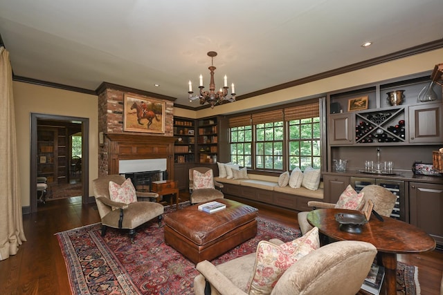 835 Jackson Grove Rd, Columbus, NC 28722 - living room featuring a chandelier, crown molding, a glass covered fireplace, a bar, and dark wood-style floors
