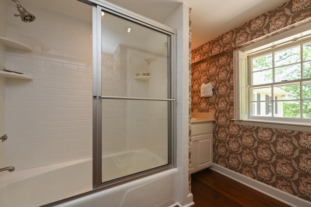 835 Jackson Grove Rd, Columbus, NC 28722 - bathroom featuring wallpapered walls, wood finished floors, shower / bath combination with glass door, and vanity
