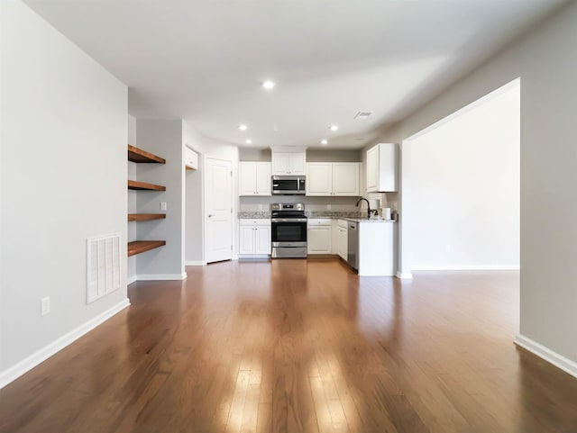 510 Bucklebury Rd, Greer, SC 29651 - unfurnished living room featuring dark wood-style floors and recessed lighting