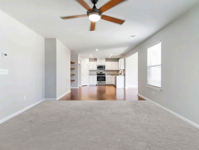 510 Bucklebury Rd, Greer, SC 29651 - unfurnished living room with dark colored carpet, a ceiling fan, and recessed lighting