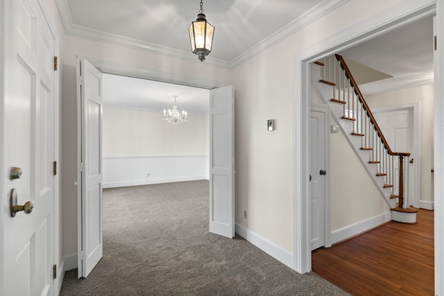 802 Hickory Hollow Rd, Inman, SC 29349 - corridor with stairs, a chandelier, ornamental molding, and dark carpet