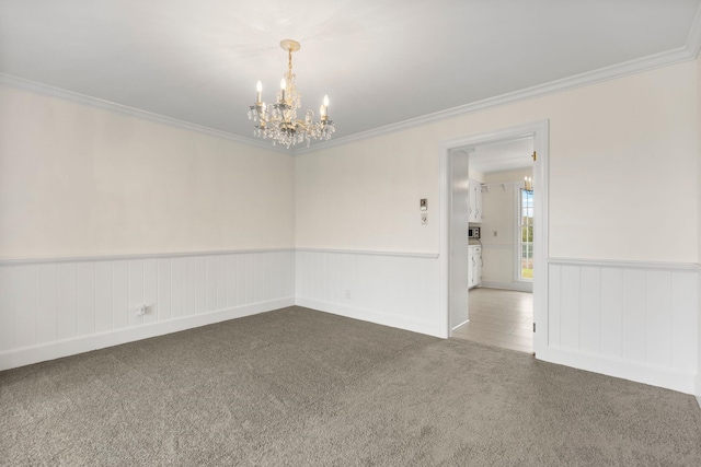 802 Hickory Hollow Rd, Inman, SC 29349 - empty room featuring a chandelier, carpet flooring, crown molding, and wainscoting
