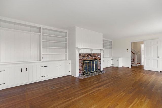802 Hickory Hollow Rd, Inman, SC 29349 - unfurnished living room featuring wood finished floors, built in shelves, stairway, and a fireplace