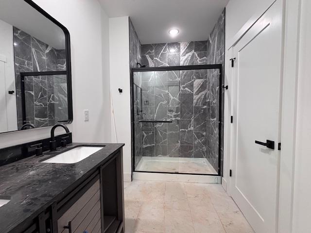 179 Cedar Ave, Wellford, SC 29385 - bathroom featuring marble finish floors, double vanity, and a marble finish shower