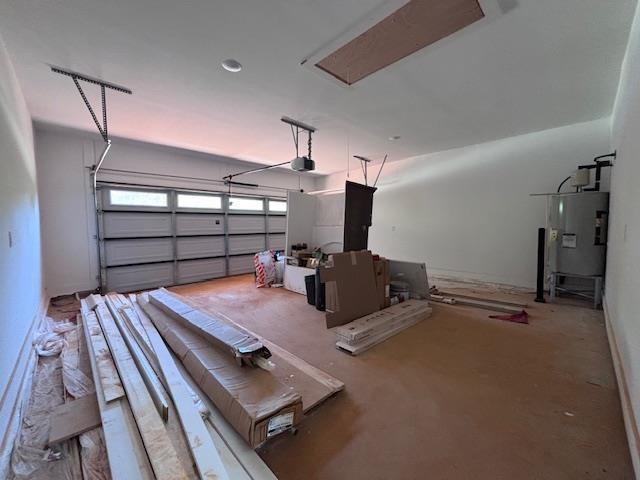179 Cedar Ave, Wellford, SC 29385 - garage featuring water heater and a garage door opener