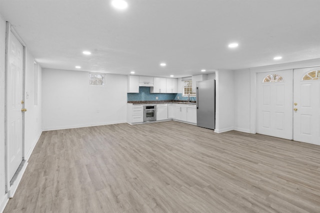 21 U St, Honea Path, SC 29654 - unfurnished living room with recessed lighting and light wood-style flooring