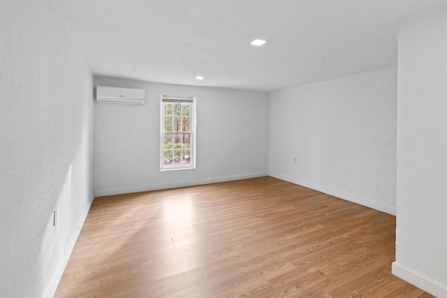 21 U St, Honea Path, SC 29654 - unfurnished room featuring a wall mounted air conditioner and light wood-style flooring